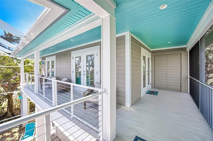 Wooden deck featuring french doors