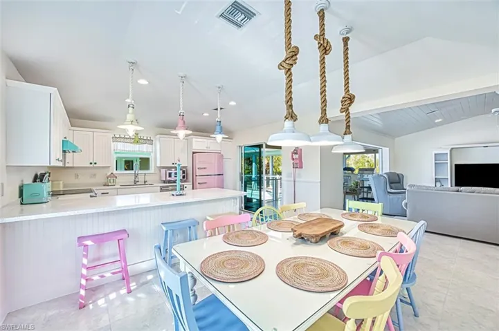 Dining space with lofted ceiling