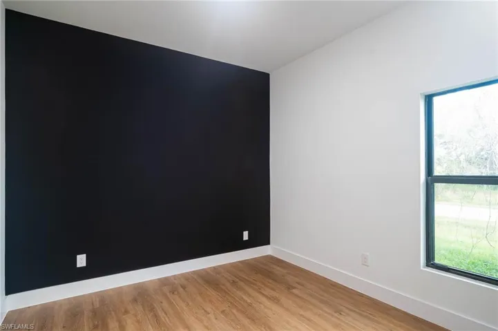 Unfurnished room featuring light wood-type flooring