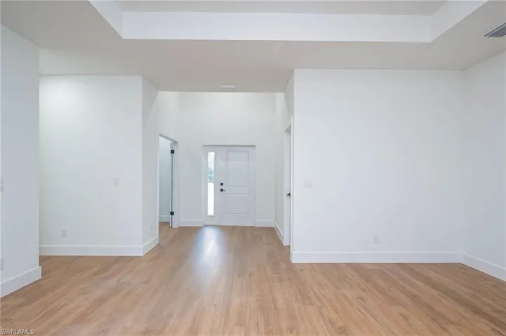 Foyer with light hardwood / wood-style flooring