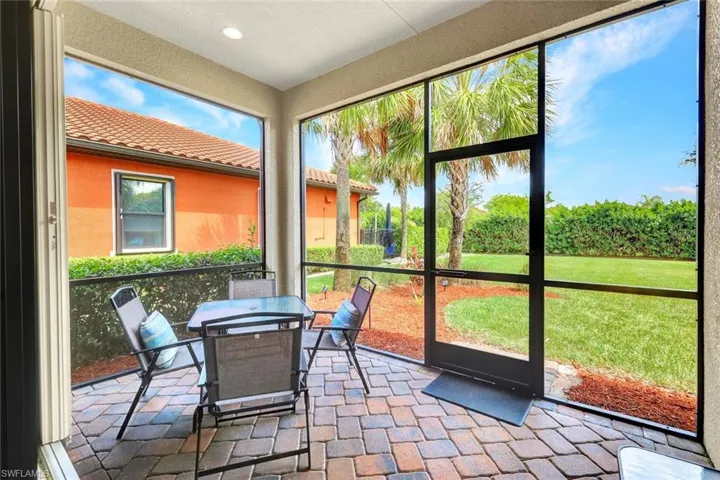 Sunroom featuring outdoor dining area