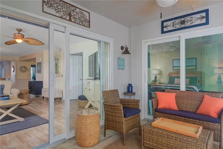 Sunroom / solarium featuring ceiling fan