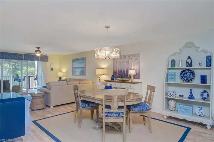 Dining room with ceiling fan and light hardwood / wood-style floors