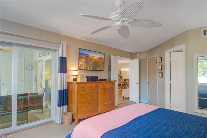 Bedroom featuring access to exterior and ceiling fan