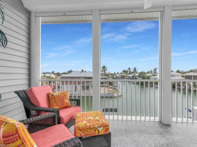 Sunroom / solarium with a water view