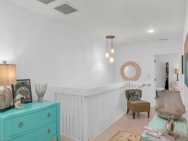 Living area featuring light tile patterned flooring