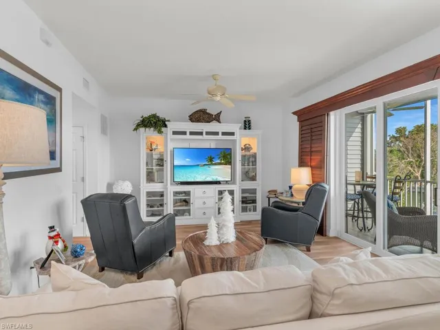 Living room featuring light hardwood / wood-style flooring and ceiling fan