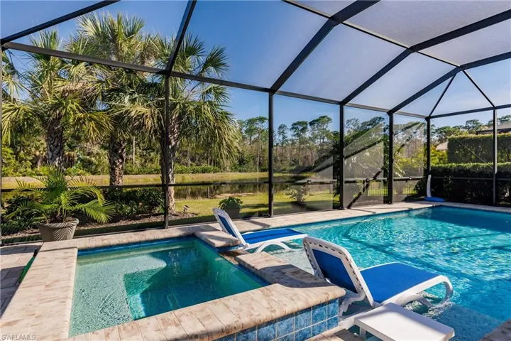 Saltwater pool/spa combo with private lake and preserve view.