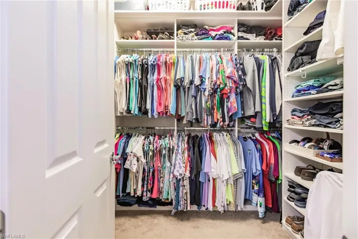 Walk in closet with custom shelving
