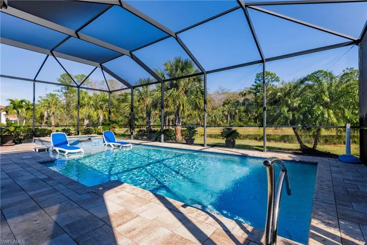 Large saltwater pool/spa with private lake and preserve view.