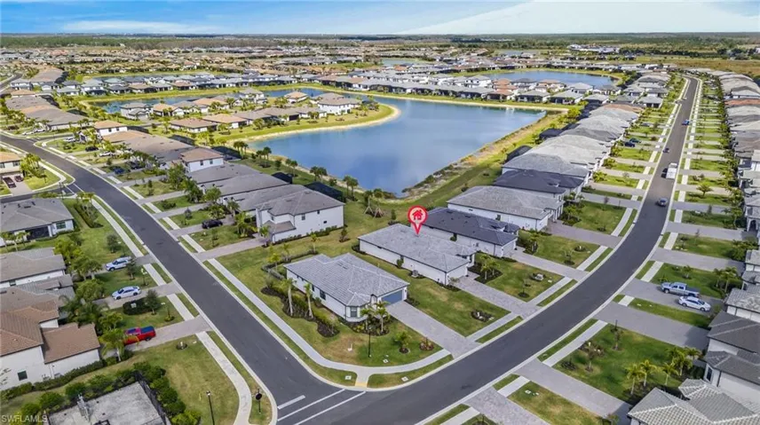 Aerial overview of property's location featuring nearby suburban area and a nearby body of water