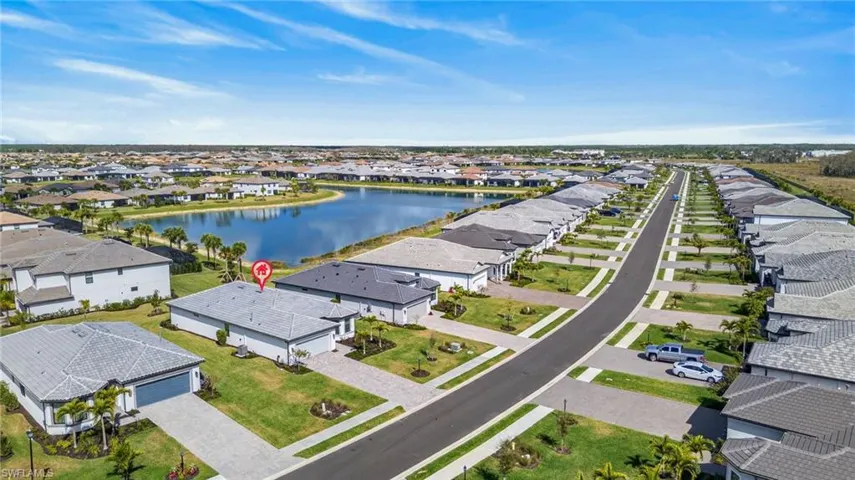 Aerial perspective of suburban area with a nearby body of water