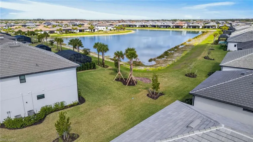 Aerial perspective of suburban area with a large body of water