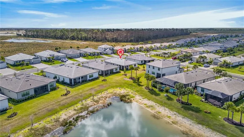 Aerial view of residential area with a large body of water