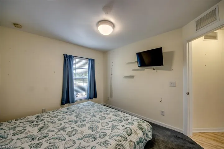 Bedroom with light hardwood / wood-style flooring