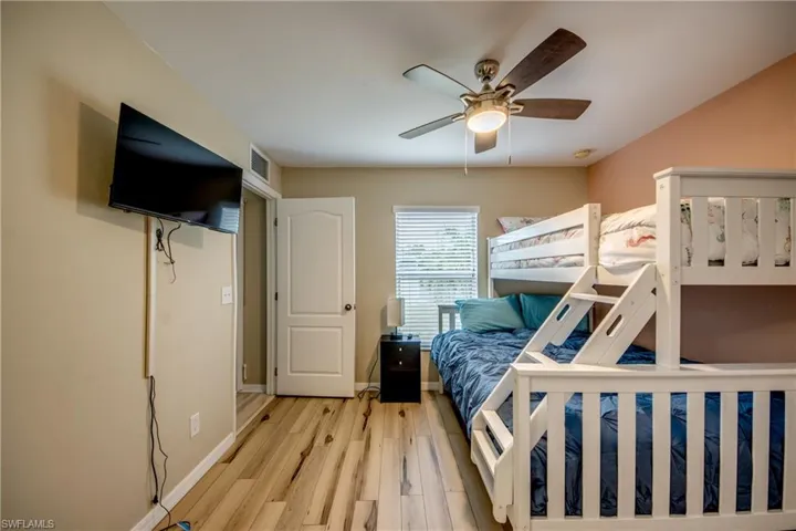 Bedroom featuring ceiling fan and light hardwood / wood-style floors