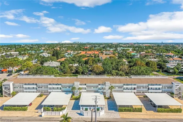 Carport parking, community elevator, stairs on either end.