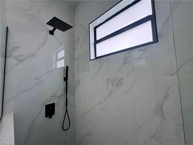Bathroom featuring tiled shower