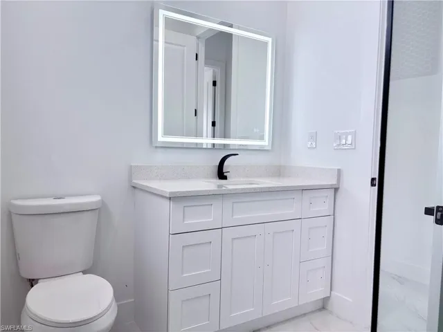 Bathroom with vanity and toilet