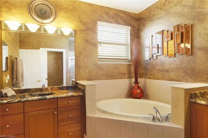 Master Bathroom has soaking tub and mirror