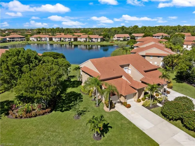 Aerial perspective of suburban area featuring a large body of water