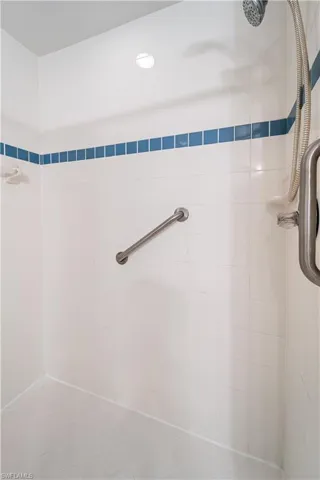 Full bathroom with tiled shower