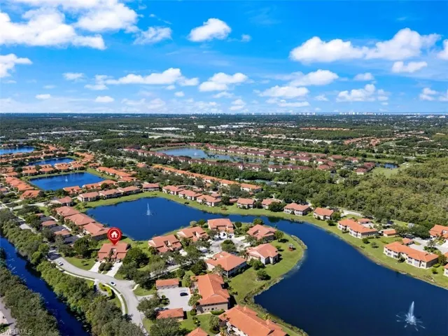 Aerial perspective of suburban area with a large body of water