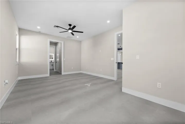 Empty room featuring ceiling fan