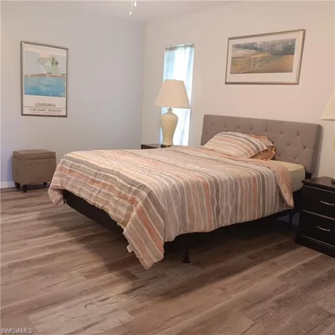Bedroom with wood-type flooring