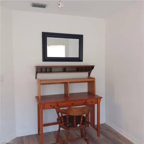 Miscellaneous room with hardwood / wood-style flooring