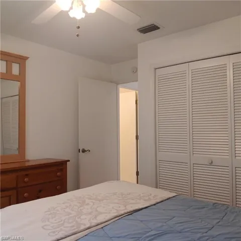 Unfurnished bedroom featuring a closet and ceiling fan