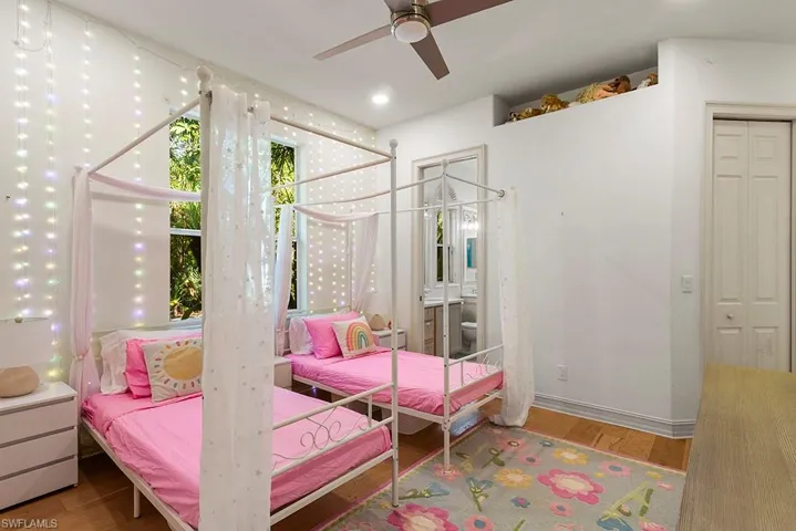 Bedroom featuring light wood-style flooring and ceiling fan