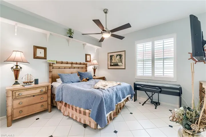 Bedroom 2 with tile floor, new fan and plantation shutters
