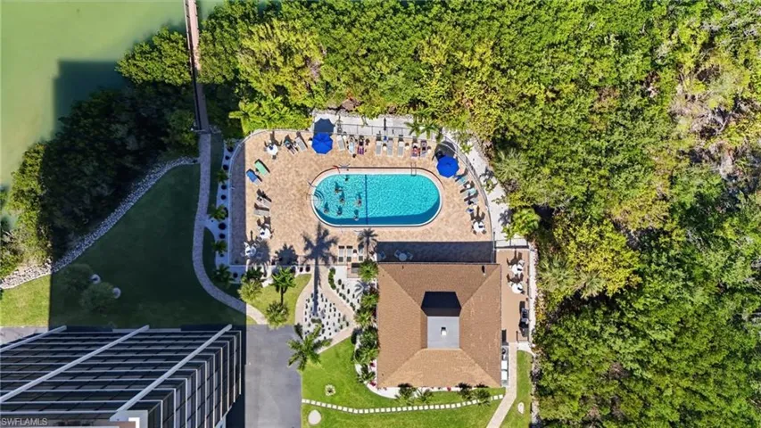 Inviting pool, clubhouse, and grill area—perfect for relaxing or gathering with friends.