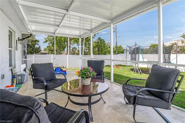 Sunroom / solarium featuring a healthy amount of sunlight