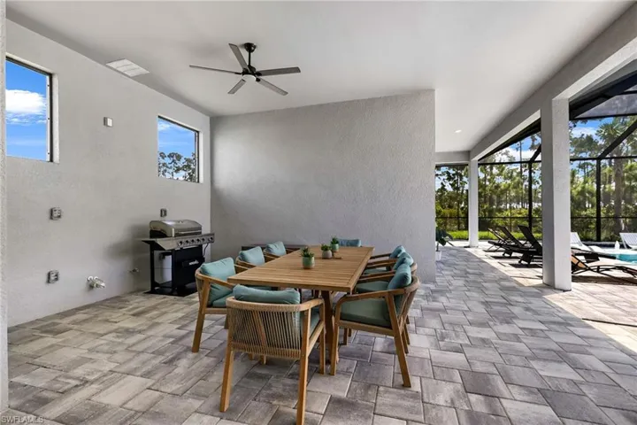 Dining space with ceiling fan and light tile patterned floors