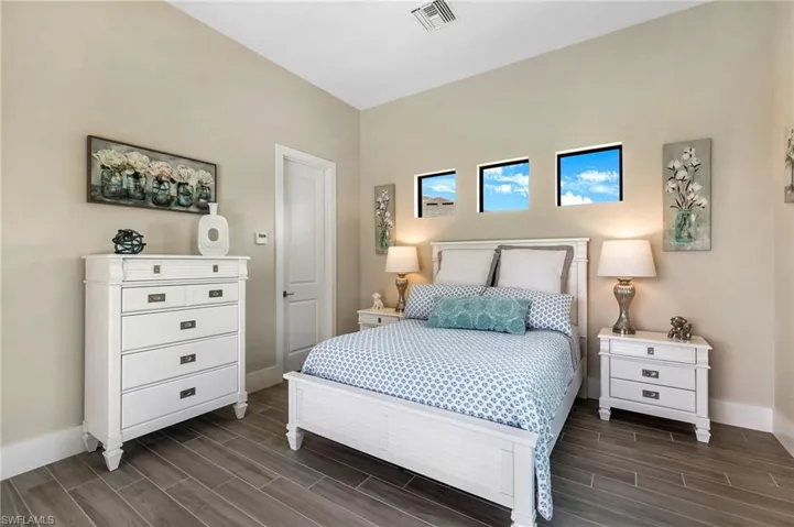 Bedroom with dark wood-type flooring