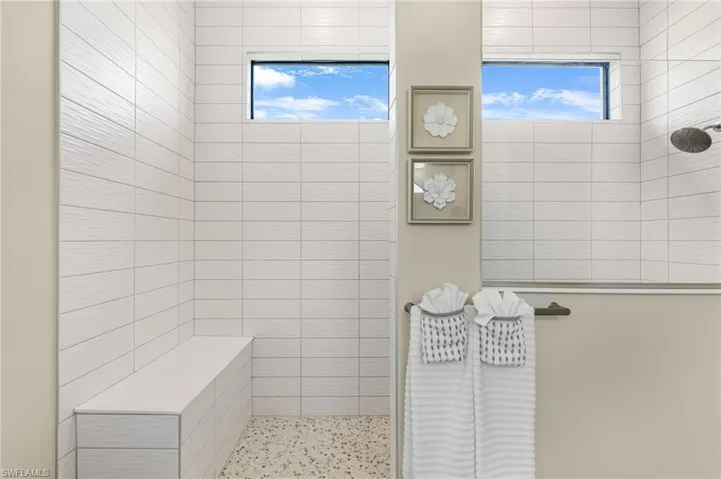 Bathroom featuring a tile shower