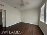 Spare room featuring dark hardwood / wood-style flooring