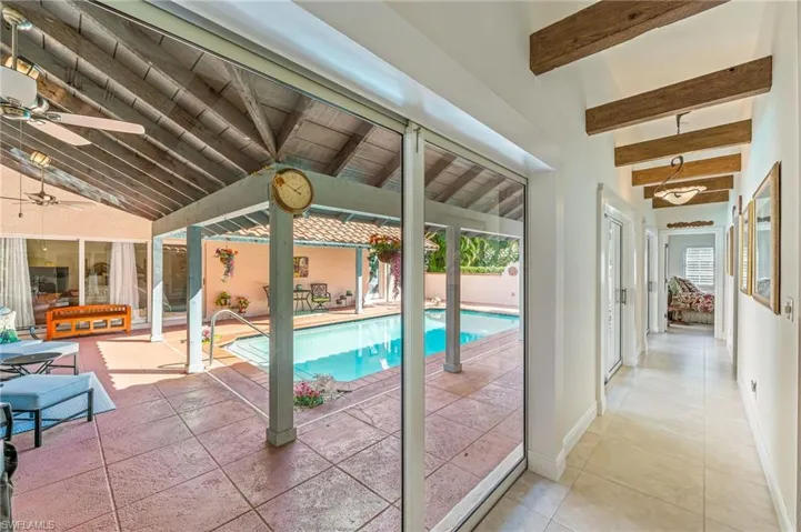 View of pool with a ceiling fan