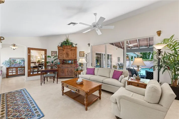 Living room featuring high vaulted ceiling