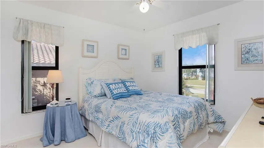 Carpeted bedroom with ceiling fan
