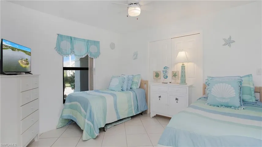 Tiled bedroom with ceiling fan