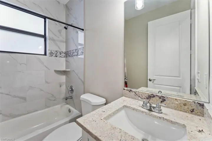 Full bathroom featuring vanity and shower / washtub combination