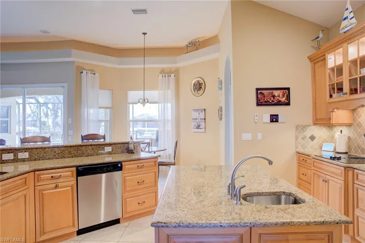 “Gourmet Kitchen with Granite, Stainless Steel, and Island Seating”The heart of the home—perfectly equipped for everyday meals or entertaining in style.