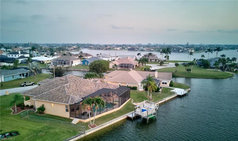 “Waterfront Living with Canal Access to 7 Lakes”A bird’s-eye view of your slice of paradise—boating, fishing, and Florida sunsets await!