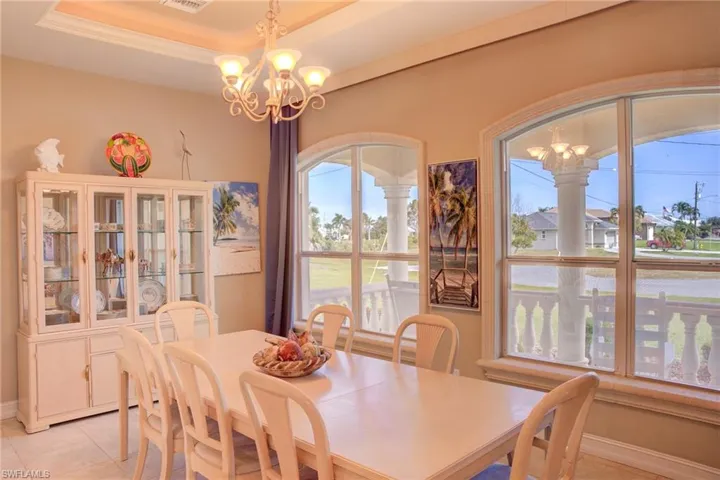 “Formal Dining Framed by Architectural Columns”An elegant space for entertaining, flooded with natural light.