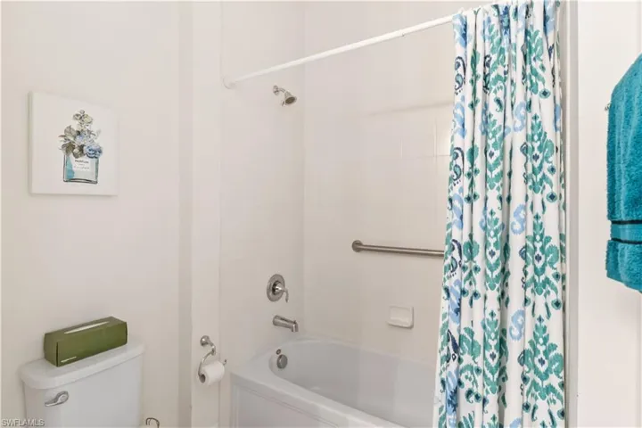 Generously sized guest bathroom with ample space for comfort and convenience.