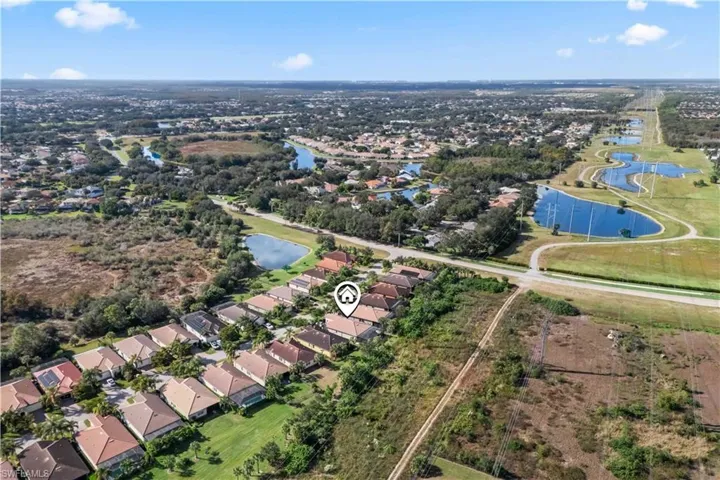 Bird’s-eye view of Timberwood Preserve showcasing tree-lined streets and preserve-backed lots.