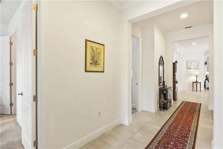 Welcoming entryway with tile flooring and open sightlines to the living and dining areas.